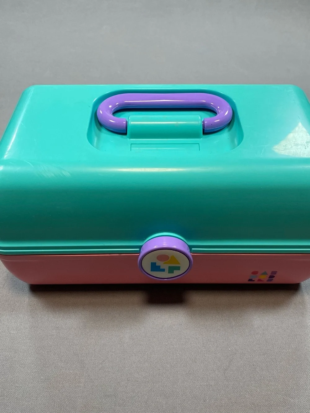 Vintage Caboodles Pink and Teal Makeup Case with Purple handle.
